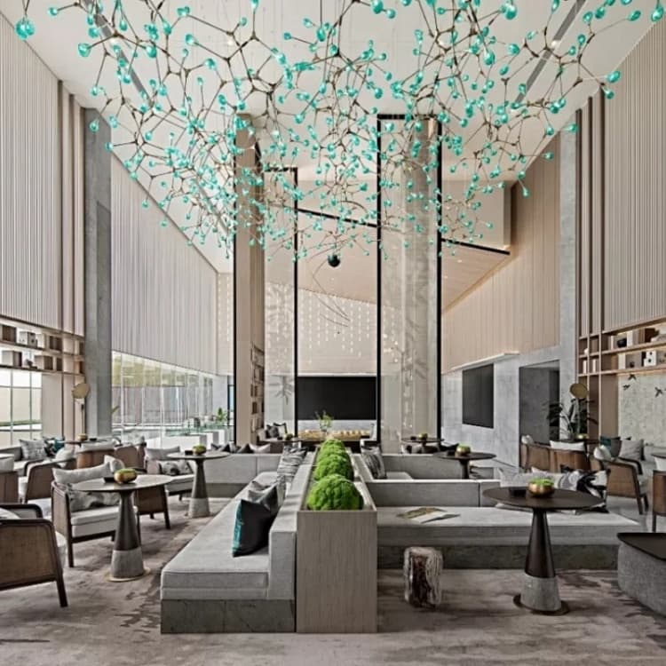 Turquoise suspended canopy and vertical cascades above a large lobby